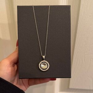 Round rhinestone pendant on silver chain